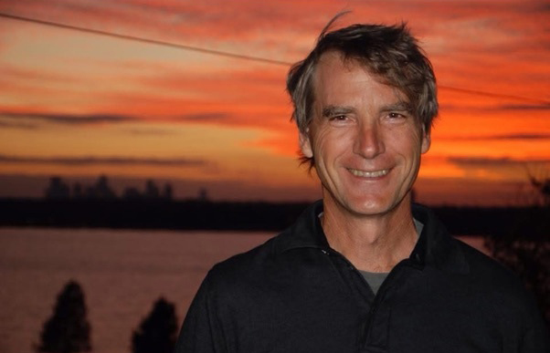 Portrait photo of Rich Enthoven against sunset